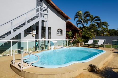 Kolam renang di atau dekat dengan Village Itaúna Inn - Casas de Temporada para Famílias