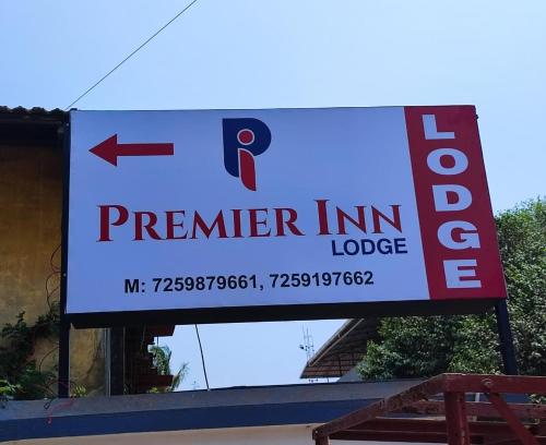 a sign for a premier inn lodge on a building at PREMIER INN LODGE in Mangalore