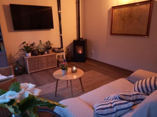 a living room with a couch and a table at Hotel Bahia in La Isla