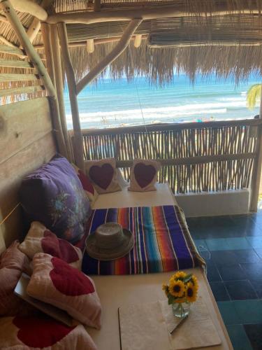 a room with two beds with a view of the beach at Casa Love in Sayulita