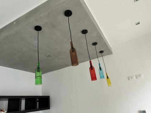 a group of five lights hanging from a ceiling at Cà Dei Barcaroli in Mestre