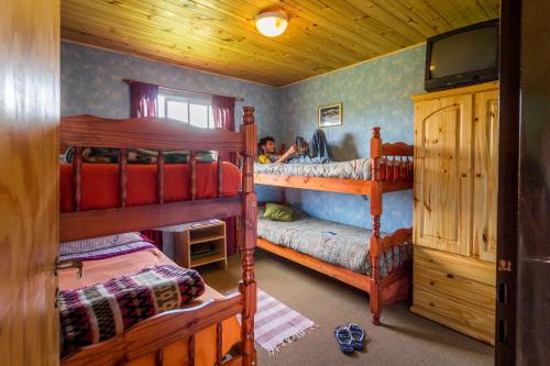 Postel nebo postele na pokoji v ubytování Piuke Mapu Patagonia Hostel
