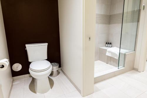 a bathroom with a white toilet and a shower at Lift Park City Condominiums in Park City
