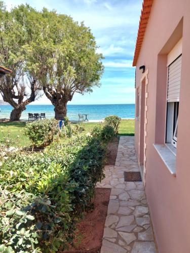 a walkway to the beach from a house at Lila Villas in Stalos