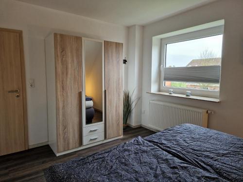 Katil atau katil-katil dalam bilik di Ferienwohnung Wellenbrecher