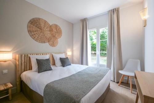 Posteľ alebo postele v izbe v ubytovaní Villa Rêve de Plage proche St-Tropez