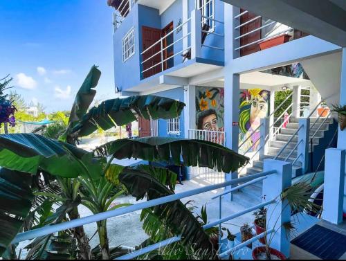 a building with a mural on the side of it at Costa Nube in Caye Caulker