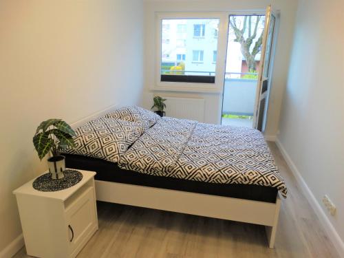 Ένα ή περισσότερα κρεβάτια σε δωμάτιο στο Apartament centrum Świnoujście 1