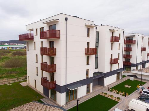 an aerial view of a white building with balconies at Apartament Marbud 2 przy Aquaparku Reda in Rumia
