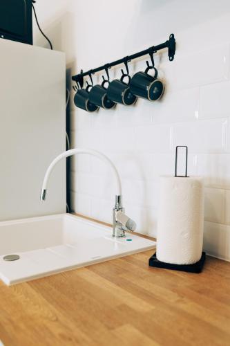 a kitchen sink with a bunch of pots and pans at Apartament Marbud 2 przy Aquaparku Reda in Rumia