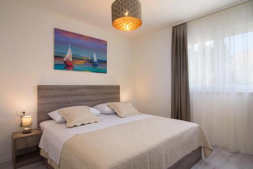 Katil atau katil-katil dalam bilik di Villa Barbara & Zoran with heated swimming pool