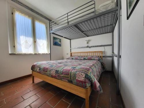 a bedroom with a bed in a room at Solaris18 in Marina di Campo