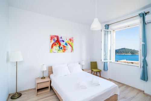 Posteľ alebo postele v izbe v ubytovaní Dubrovnik SEA VIEW MAGNOLIA APARTMENTS