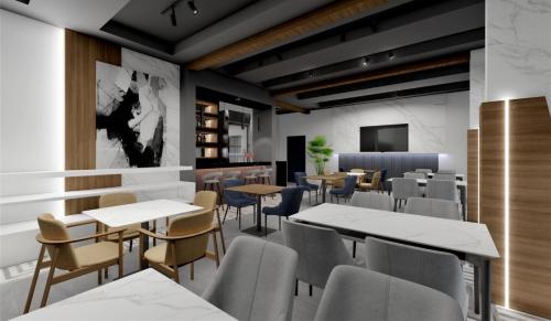 a restaurant with tables and chairs and a tv at Sunrise Apart-Hotel in Ulcinj