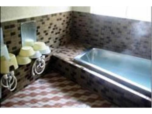 a bathroom with a sink and a counter with towels at Hotel Marui - Vacation STAY 14597v in Shibata