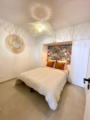 Posteľ alebo postele v izbe v ubytovaní Appartement moderne + Parking à 50m de la mer