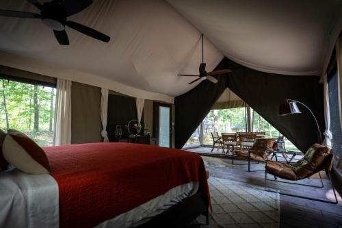 a bedroom with a bed and a ceiling fan at Pine Mountain RV Resort in Pine Mountain