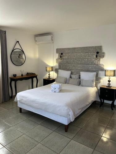 Postel nebo postele na pokoji v ubytování Chambres d'hôtes Casa Pruneta