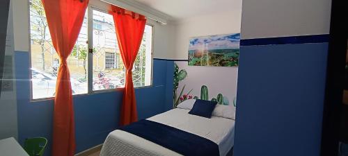 Postel nebo postele na pokoji v ubytování Casa Hotel Manco Mora