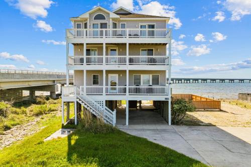 a house on the beach with a pier at Sound Happy in Rodanthe