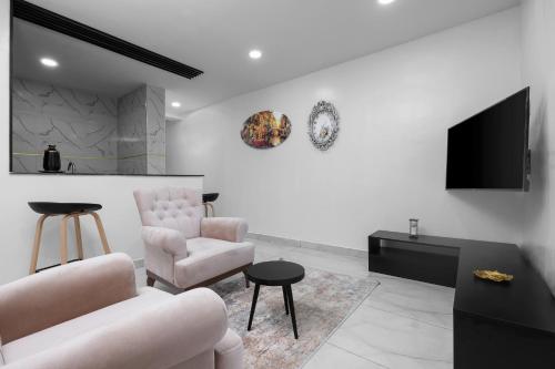 A seating area at BKT Cribs - Apartments & Suites