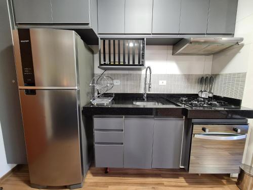 Η κουζίνα ή μικρή κουζίνα στο Loft Cama King 3 min do centrinho