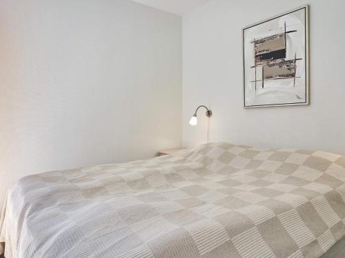 En eller flere senge i et værelse på Holiday home Nexø XLI