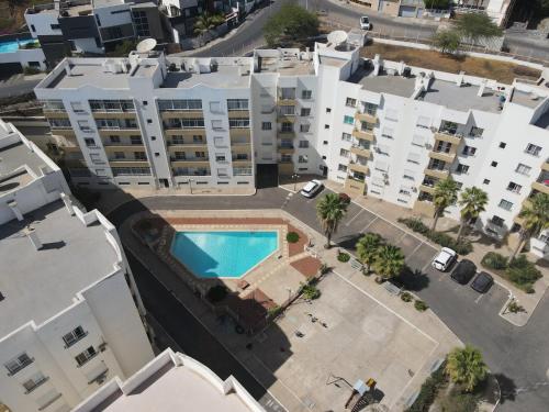 an overhead view of a apartment complex with a swimming pool at Kaps Home - Miramar D4 in Praia