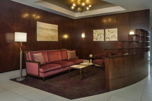 a living room with a couch and a table at SpringHill Suites by Marriott Philadelphia Airport / Ridley Park in Ridley Park