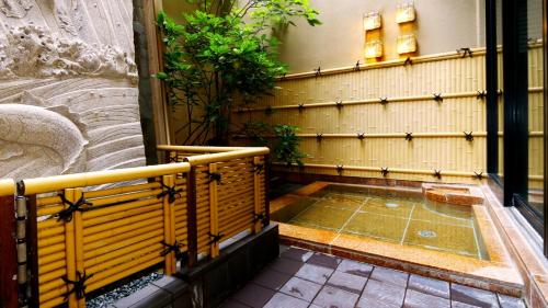 a small plunge pool in the side of a building at Oyado Yamashita in Kanazawa