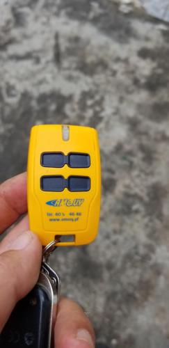 a person holding a small yellow object in their hand at Puna Home in Punaauia