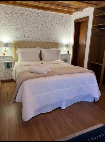 מיטה או מיטות בחדר ב-Pousada Dulce Ville