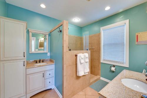 a bathroom with a shower and a sink at Lake Keowee Condo with Balcony and Resort Amenities! in Salem