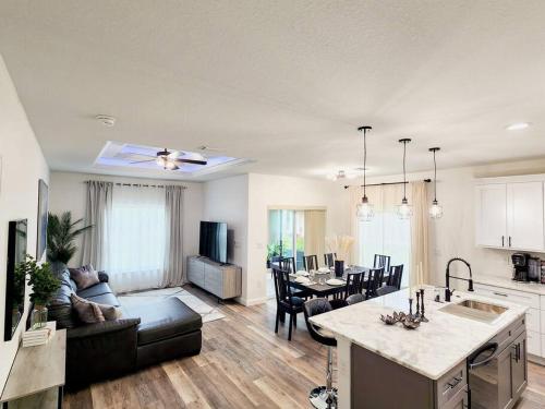 a kitchen and living room with a couch and a table at Beautiful family vacation house in Rotunda-West