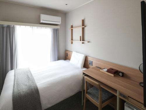 东京浅草筑波快速船舶酒店(Vessel Inn Asakusa Tsukuba Express)房間的床