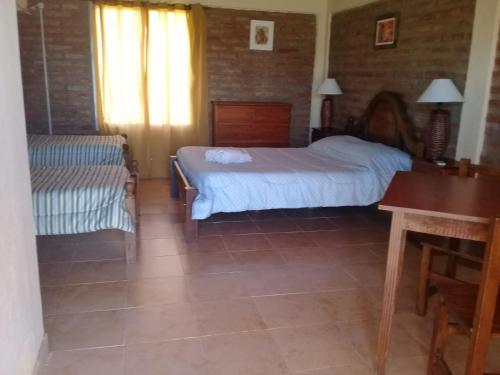 Ένα ή περισσότερα κρεβάτια σε δωμάτιο στο HOTEL FINCA AMANCAY