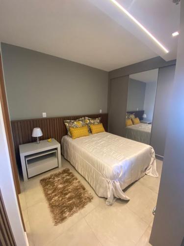 Ένα ή περισσότερα κρεβάτια σε δωμάτιο στο Flat charmoso Jardim Botanico