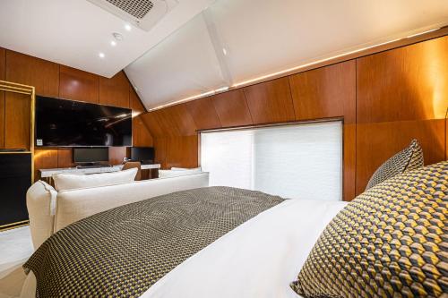 a bedroom with a large bed in a boat at Jongno Olive Hotel in Seoul