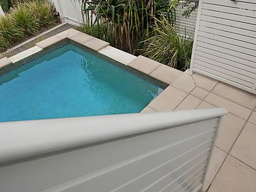 a small swimming pool in the side of a house at 1 20 Kingfisher Drive Peregian Beach in Peregian Beach
