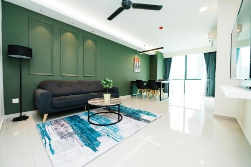 a living room with a couch and a table at Chill Suites Kuala Lumpur in Kuala Lumpur