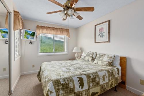 a bedroom with a bed and a ceiling fan at Deer Ridge Mountain Resort C202 in Gatlinburg