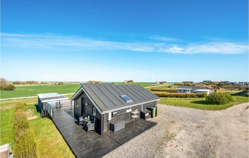 an overhead view of a house with a deck at Two-Bedroom Holiday Home In Lemvig in Lemvig