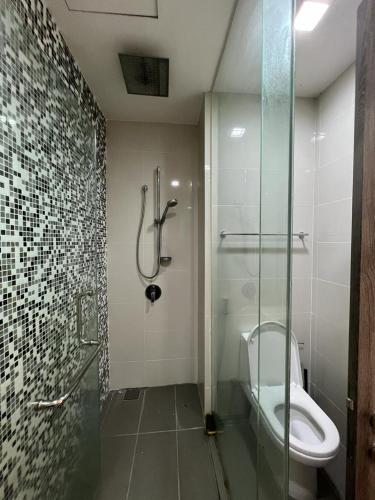 a bathroom with a shower stall and a toilet at Kuala Lumpur near KLCC Soho Suite in Kuala Lumpur