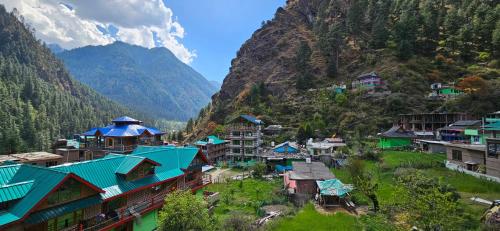 an aerial view of a village in the mountains at Parbati Headquarters in Kasol