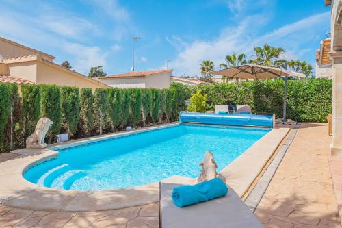 a swimming pool in the backyard of a house at Casa Mayor Strand Es Trenc 5 min in Sa Ràpita