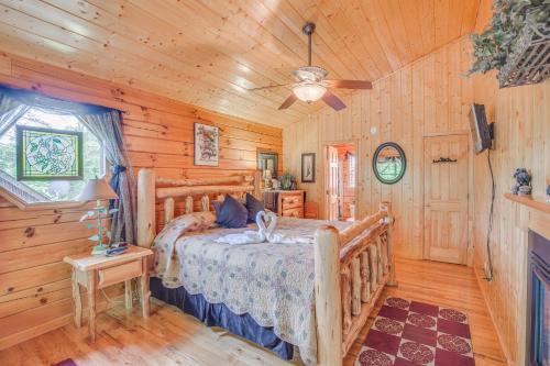 a bedroom with a bed in a log cabin at Bear Escape, 1 Bedroom, Sleeps 4, Hot Tub, Pool Table, Jacuzzi Tub in Sevierville