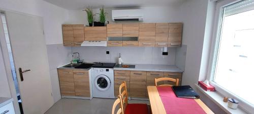 A kitchen or kitchenette at JO-MA APARTMENT - SAFE parking and chrg station