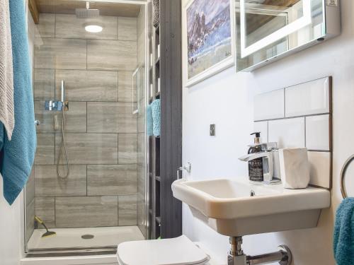 a bathroom with a sink and a shower at Shepherds Loft in Benson