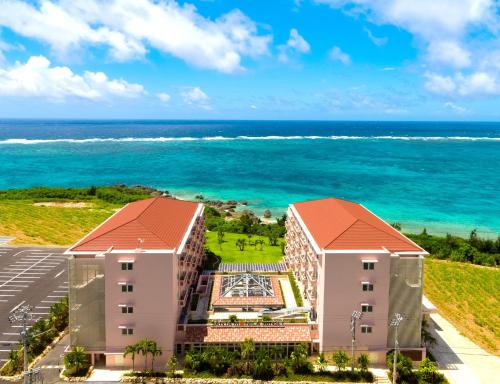 an aerial view of a resort with the ocean in the background at Hot Cross Point Santa Monica in Miyako Island