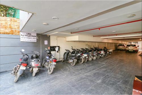 a row of motorcycles parked in a garage at FabExpress La Serene - Near Yamuna Sports Complex in New Delhi